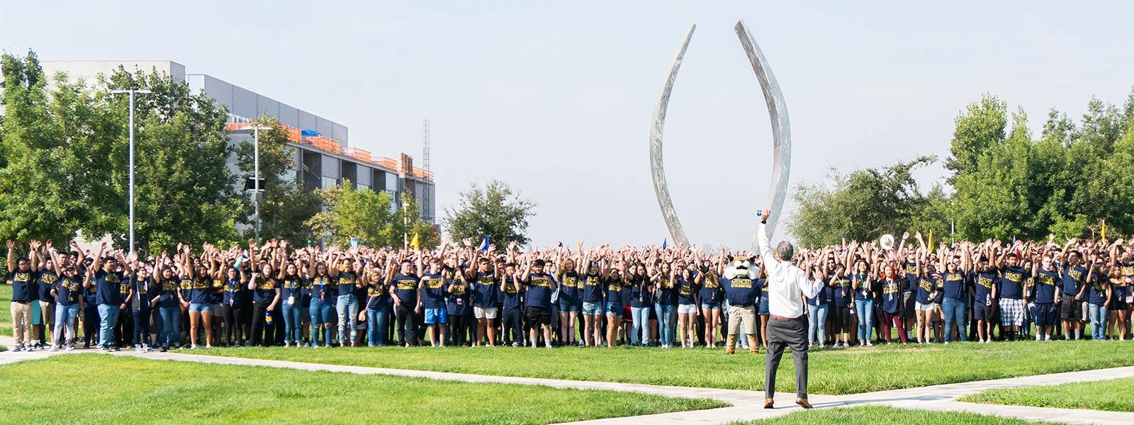 a group of students celebrating on campus