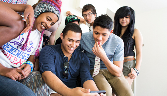 UC Merced - Admissions - Students looking at a smart phone