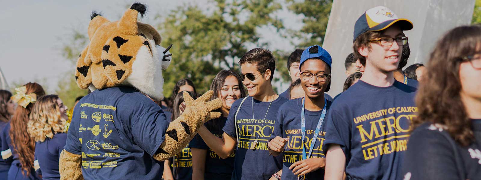 a group of students celebrating on campus