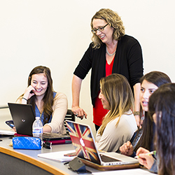 Students in classroom with advisor