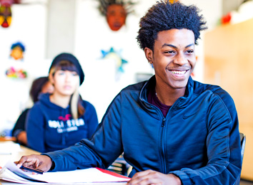 Student laughing in a classroom