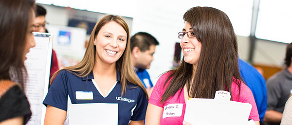 counselors and educators talking with students
